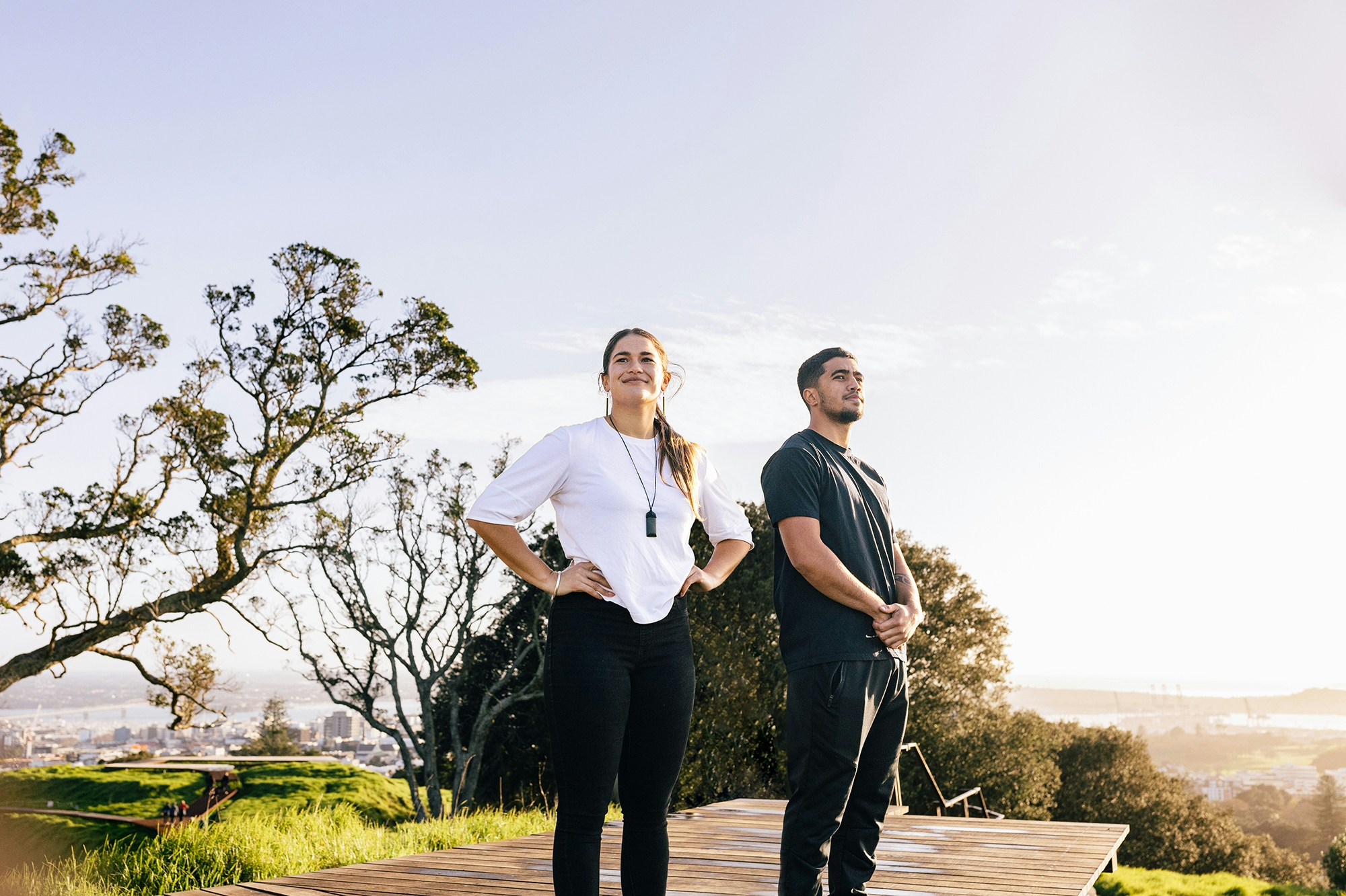 Man and woman couple admiring views on Mount Eden boardwalk landscape resized